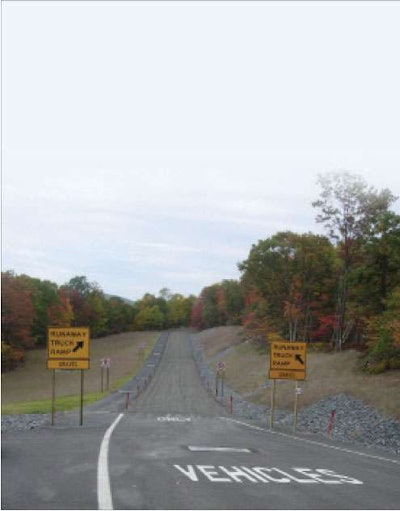 Proper braking on severe grades will keep you from having to veer into the deep gravel of a runaway truck ramp such as this one in Pennsylvania's Pocono Mountains.