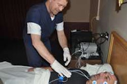 A technican for Sleep Pointe at Prime Inc.'s off-site sleep lab in Springfield, Mo., shows how he readies a patient for sleep apnea testing. (Photo Randy Grider)