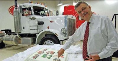 Peterbilt General Manager Bill Jackson cuts the company's 70th anniversary cake at the Denton, Texas, plant. The white Model 359 was the first truck off the plant's assembly line when it opened 29 years ago.