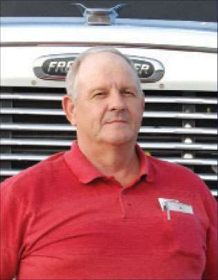 Robert Wilbur, a 23-year veteran with Bennett Motor Express and the fleet's 2008 Driver of the Year, stopped his 2004 Freightliner Classic in Cottondale, Ala., while en route from Ft. Polk, La., to Ft. Campbell, Ky., with a cargo truck and John Deere gator loaded on his 53-ft. step-deck.