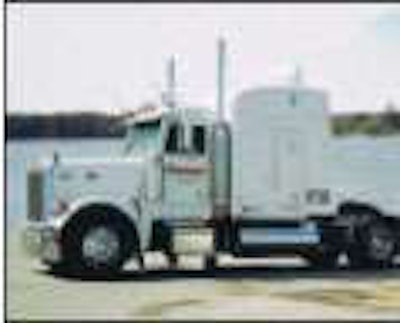 Tim Costen lease-purchased his 1999 Peterbilt 379, shown here on the Mississippi River bank.