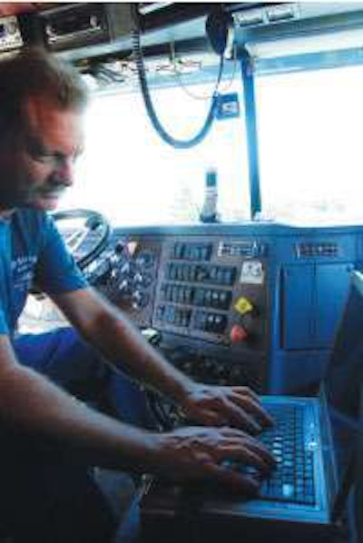 Laptops and smart phones allow owner-operators like Andy Soucy, leased to Landstar, easy access to freight market information that is key to successful rate negotiation.