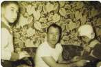 Mike Crawford (left) with his father and brother at Christmas in Ava., Mo.