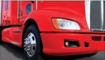 A completely enclosed, aerodynamic front bumper and headlight system helps guide air around the lower front of the tractor.