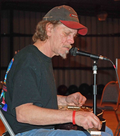 Watermelon Slim performs at Overdrive's office.