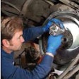 A technician works on a clutch at Western Truck Parts in Henderson, Colo. Clutch failure is among the problems that can result from a faulty crankshaft damper.