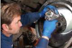 A technician works on a clutch at Western Truck Parts in Henderson, Colo. Clutch failure is among the problems that can result from a faulty crankshaft damper.