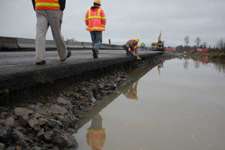 Flooding damaged roads and bridges in Rhose Island.