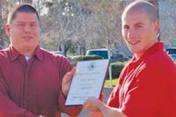 Shawn Hubbard (left) receives Highway Angel award from Josh Goldman, Ruan Transport terminal manager in Rialto, Calif.