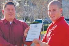 Shawn Hubbard (left) receives Highway Angel award from Josh Goldman, Ruan Transport terminal manager in Rialto, Calif.