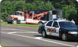 The first priority of law enforcement officers arriving at the scene is clearing the highway to prevent other accidents. Though it varies by municipality, police often call a company on a rotating list of towers they trust.