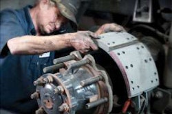 Kirk Beckham performs brake work at Southland International Trucks in Tuscaloosa. Preventive maintenance scheduled at home costs much less than emergency work on the road.