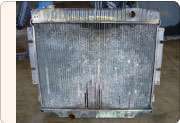 Regularly spraying water forward through the radiator will minimize corrosion, enhance air flow and reduce the likelihood of a time-consuming disassembly of the fins for cleaning.