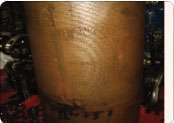 This wet sleeve cylinder liner from the engine block is marked by cavitation, or tiny bubbles that eat into the surface when nitrite levels in coolant are too low. Cavitated liners allow coolant to get into engine oil.