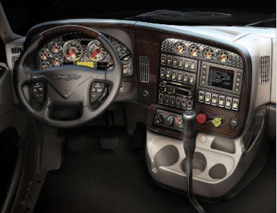 The dashboard reflects custom truck design elements, such as the hooded gauge bezels.