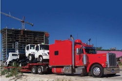 Leo Wilkins specializes in hauling medium-duty truck bodies and highway construction safety equipment.