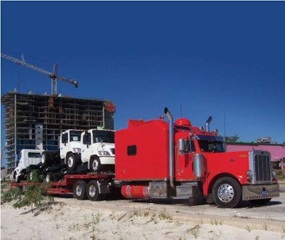 Leo Wilkins specializes in hauling medium-duty truck bodies and highway construction safety equipment.