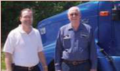 Veteran owner-operator Richard Daniels, 80, of Akron, Ohio, pulls a reefer for summer deliveries for Kandel Transport, the company he sold to his son Jack Daniels, whom he stands beside in a photo taken circa 2002.