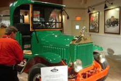 A customer views an early Mack truck in the new Mack Museum and Heritage Center.