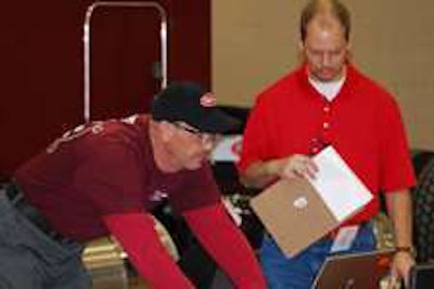 A judge watches as Chris Zweifel competes during the Rush Tech Skills Rodeo. (Photo Todd Dills)