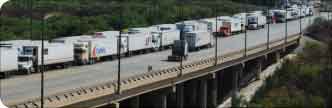 Trucks cross the World Trade Bridge over the Rio Grande in Laredo, Texas. An informal proposal from the U.S. Department of Transportation would require safety inspections and ongoing reviews for Mexican carriers that want to operate in the U.S.