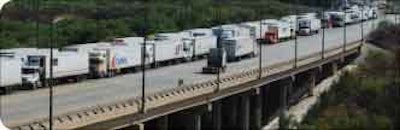 Trucks cross the World Trade Bridge over the Rio Grande in Laredo, Texas. An informal proposal from the U.S. Department of Transportation would require safety inspections and ongoing reviews for Mexican carriers that want to operate in the U.S.