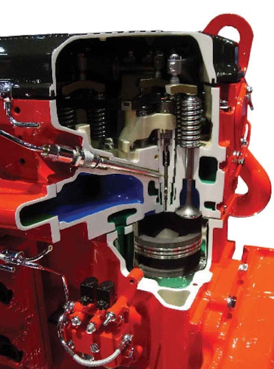 The high-pressure fuel line passes through the cylinder head and connects to the injector of a 2010 15-liter ISX. Since pressure is supplied by the XPI fuel system’s common rail, the injector is no longer camshaft-operated, but just a valve opened and closed by the ECM.