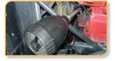 K.L. Harring Transportation and Warehousing of Bethel, Pa., uses a tank and an air-powered pump to install oil.