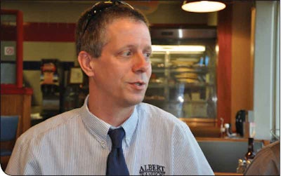 Henry Albert of Albert Transport earns cash discounts when buying fuel and comes out ahead on fuel surcharges because of his superior fuel mileage.