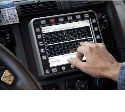 A U.S. Xpress driver calls up information on his dash-mounted EOBR, which the carrier plans to make available companywide.