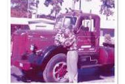 Produce hauler patriarch Ed Kimball holds his son Kevin in the late 1950s, atop his LJ Mack in St. Petersburg, Fla.