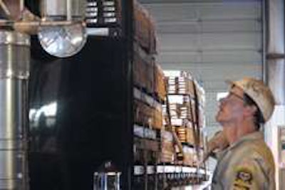 Oregon state inspector chats with driver during inspection.