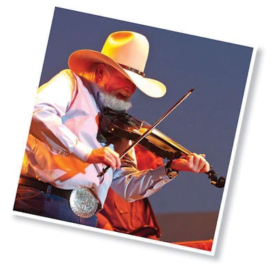 The Charlie Daniels Band played a sunset show next to the dragway. Here, Daniels grinds out “Drinking My Baby Goodbye.”