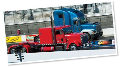Troy Huddleston of Willow Hill, Ill., pits his 1991 Viper red Freightliner Classic against Millers Creek, N.C., resident David Miller and his 1999 Freightliner FLD120 in the qualifying rounds of the show’s diesel drag races.