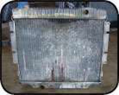 Regularly spraying water forward through the radiator will minimize corrosion, enhance air flow and reduce the likelihood of a time-consuming disassembly of the fins for cleaning.