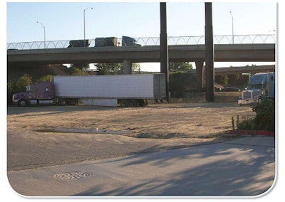 It’s not uncommon, especially in high-traffic lanes, to see trucks parked in odd places, such as these parked in a spot close to a motel and Highway 99 in Northern California.
