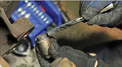 Grease the wear surface where the end of the shoe bears on either end of the anchor pin.