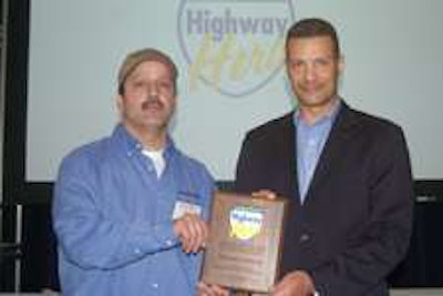 Mike Schiotis (left) receives award from Mark Pillow, director of business solutions, Goodyear Commercial Tire Systems.