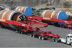 Kenworth T800s spec’d for super-heavy haul with 550-hp engines and 18-speed transmissions backed by a 4-speed auxiliary transported these massive coke drums on custom trailers. Each rig had another T800 pushing the 702,000-lb. load behind it during the slow-going moves.