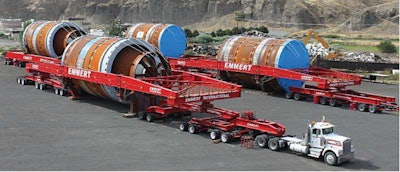 Kenworth T800s spec’d for super-heavy haul with 550-hp engines and 18-speed transmissions backed by a 4-speed auxiliary transported these massive coke drums on custom trailers. Each rig had another T800 pushing the 702,000-lb. load behind it during the slow-going moves.