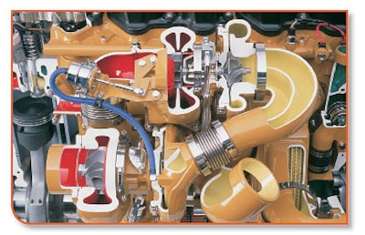 The heat exchanger under the two turbochargers is the oil cooler. Keeping the cooling system clean prevents scale in the oil cooler, too, and this means the oil stays cooler and can resist oxidation much longer.