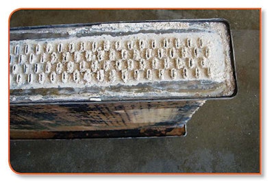 Proper cooling system maintenance means radiator tubes stay free of scale like this. That means the coolant remains at a lower temperature which, in turn, means cooler oil that better resists oxidation and thermal breakdown, and will last longer.