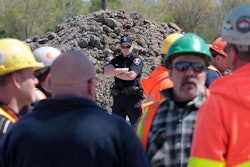 Drivers protest as a policeman stands gaurd at the Windsor-Essex Parkway project this weekend. (Photo from The Windsor Star website.)