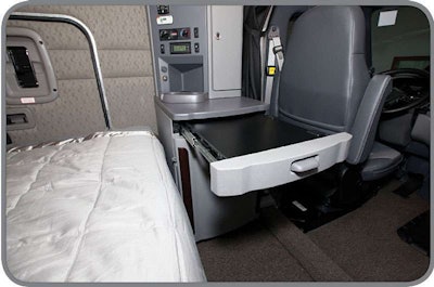 Peterbilt engineers maximized interior space utilization with innovative touches such as this slide-away work station.