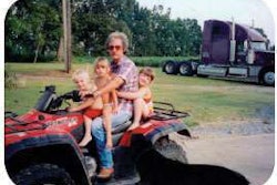 Dedication to family parallels work ethic, shown here in 2003 with grandkids and the first truck he ever purchased.