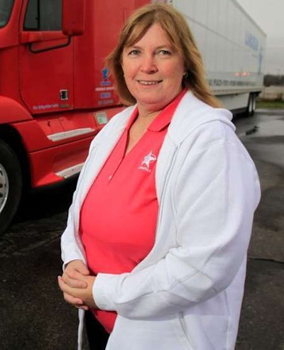 Jenny Simpson in front of her ’99 Freightliner Century