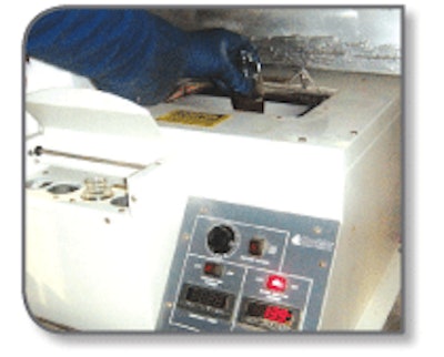 A $3,200 centrifuge separates oil from impurities.