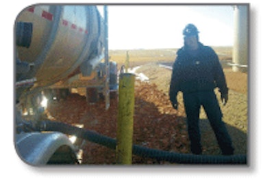 Mark Kathrein loads crude oil after they have tested it.