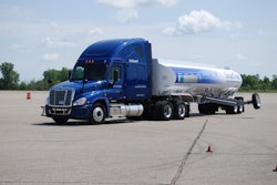 A Meritor WABCO rep shows off the company’s new ESCsmart stability control system at a press event in Romeo, Mich., Aug. 15.