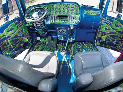 Vinyl-graphics dash elements are laid over a completely reworked surface. Botelho describes the process as one of sanding the entire, textured dash down, priming, then repeating the process before sealing it, painting it and adding a layer of clear coat before vinyl elements were added.